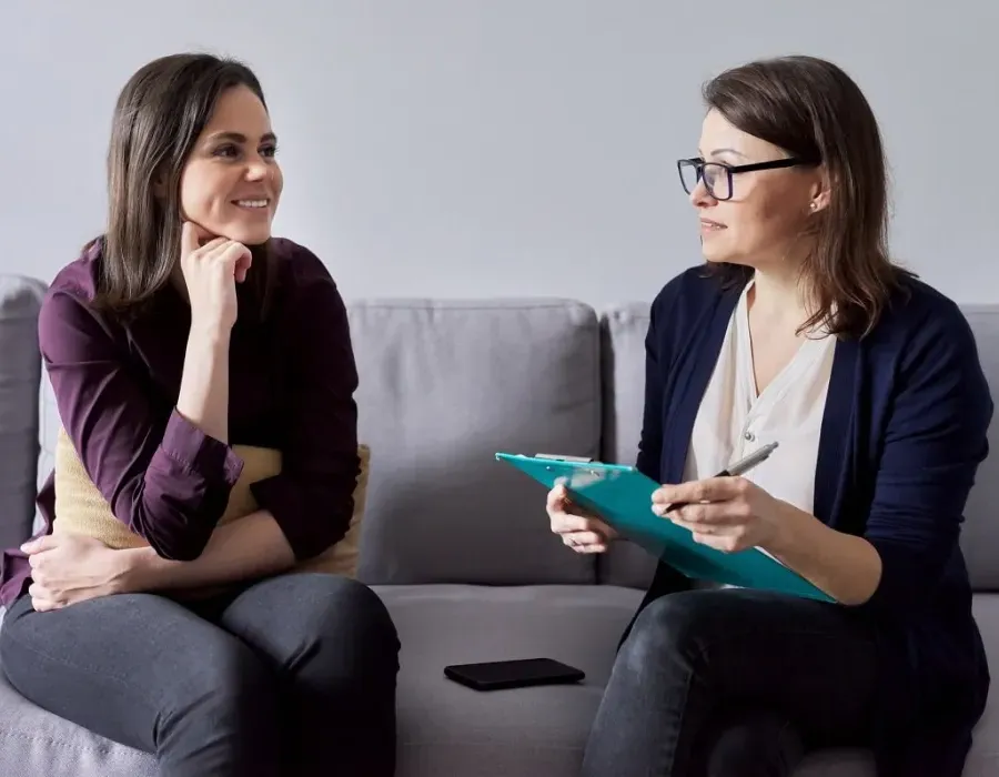 Social Worker Speaking with Client in Office